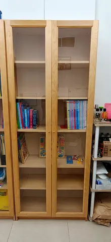 IKEA wooden bookcase with glass doors at half price