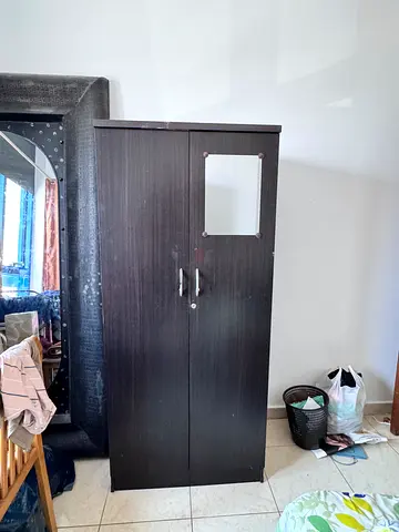 Two-door dark wood wardrobe / armoire in good condition