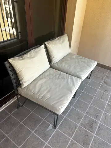 Outdoor 2-seater wicker bench with cushions