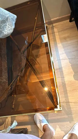 Glass top coffee table with gold metal frame - good condition