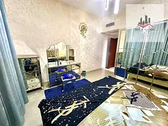 Sharjah, Al Khan, Beach Tower 2, one-bedroom apartment with a spacious living room and a view of Al
