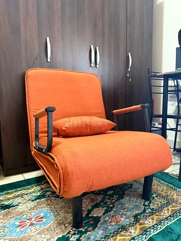 Orange fabric armchair  — gently used