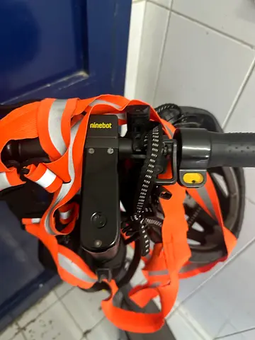 Ninebot G30 scooter in excellent condition, comes with charger, helmet, safety harness, bag, and a d