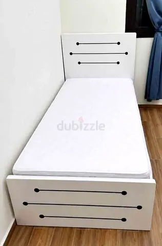 Single white wooden bed with mattress - compact design