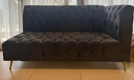 Dark grey tufted 9-seater sofa with gold legs