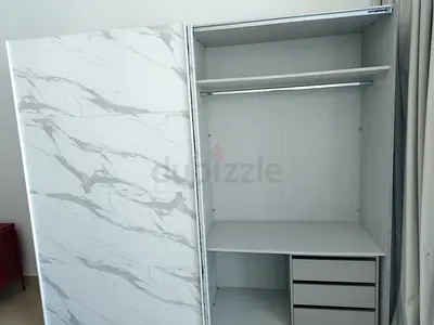 White marble-effect sliding wardrobe with shelves and drawers (good condition)