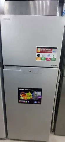 Double-door refrigerator in good condition, top freezer