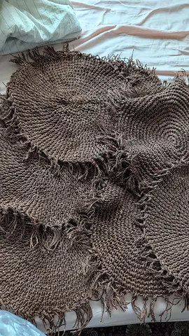 Handwoven round jute-style braided rug with fringe — neutral brown, good condition