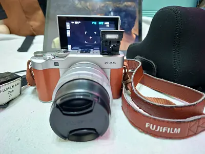 Fujifilm X-A5 mirrorless camera with 15-45mm kit lens and strap