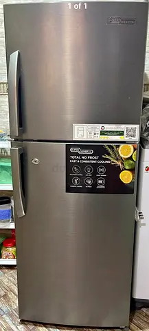 Used top-freezer refrigerator - stainless steel finish, good condition