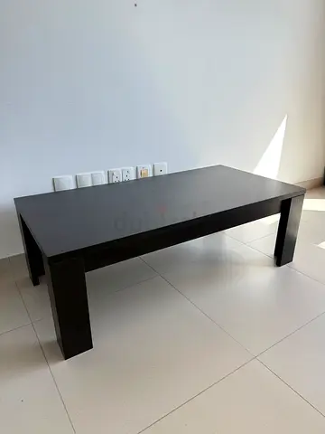 Dark wooden coffee table - sturdy modern design
