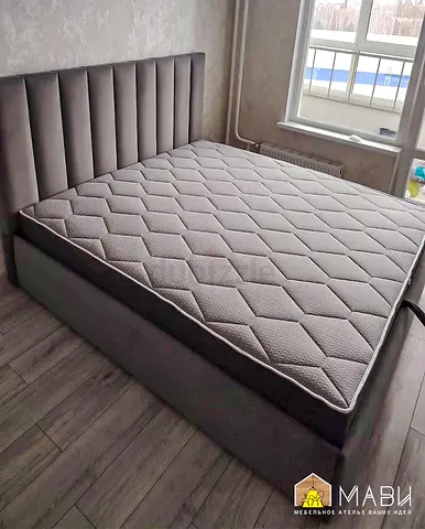 Grey upholstered double bed - modern headboard