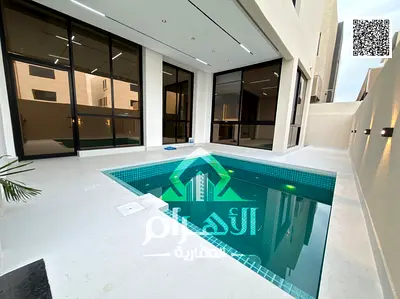 Luxury villa for sale in Al Bahia area, featuring two floors and a rooftop terrace. Modern design, spacious layouts, reception areas, and comprehensiv