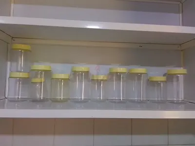 Set of 10 Clear Plastic Storage Jars with Yellow Lids - Lightly Used