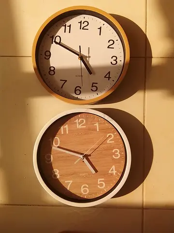 Set of 2 wall clocks — modern wooden and white designs, working condition