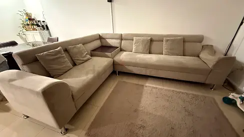 Light beige L-shaped sectional sofa — good condition