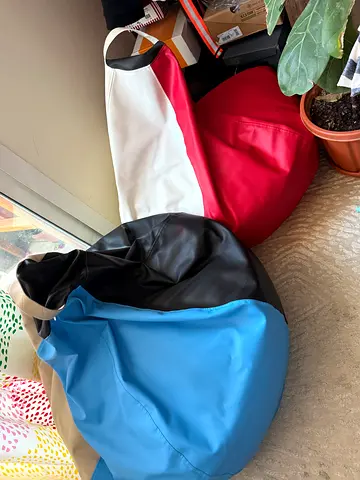 Two casual bean bag chairs - red and blue, good condition