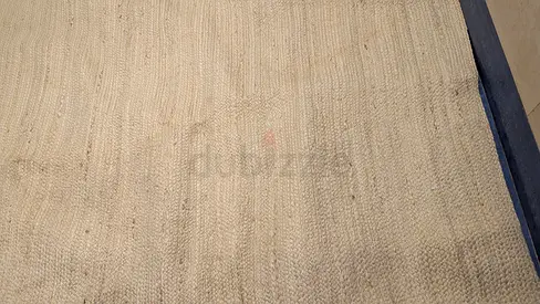 Natural beige jute-style area rug - good condition