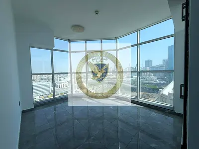 Beautiful 2-bedroom apartment with a living room and balcony, featuring an open view in Al Majaz 2. Includes free parking, gym, and swimming pool.