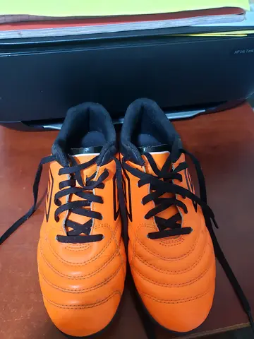 Orange football/soccer boots, lightly used