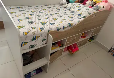 Danube Home Kinder 90X190 White and oak with built-in storage shelves and mattress.