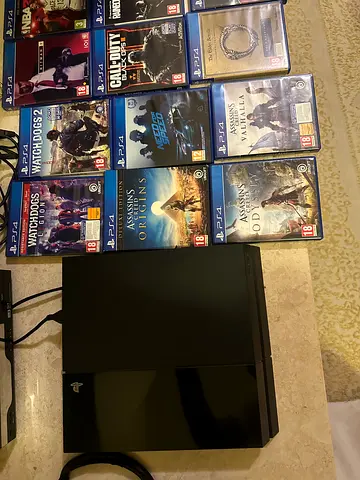 PlayStation 4 console with 12 PS4 games.