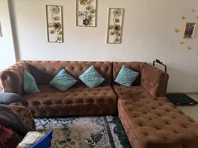 Brown tufted L-shaped sectional sofa - 4-seater, good condition