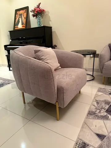 Light grey upholstered armchair with gold legs - like new
