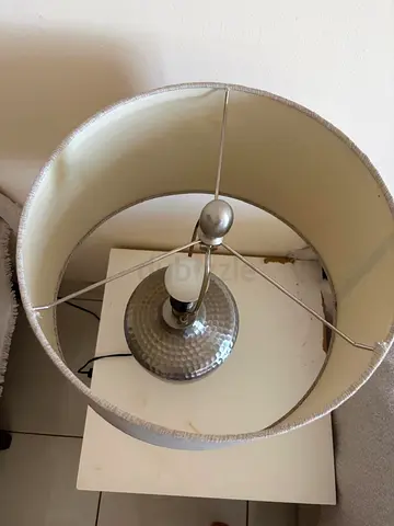 Silver table lamp (2). One lamp has a damaged metal support inside the shade. Both lamps are working