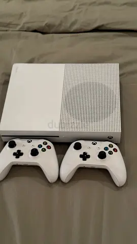 Xbox One S console with 2 controllers - white with out battery case from behind and wires