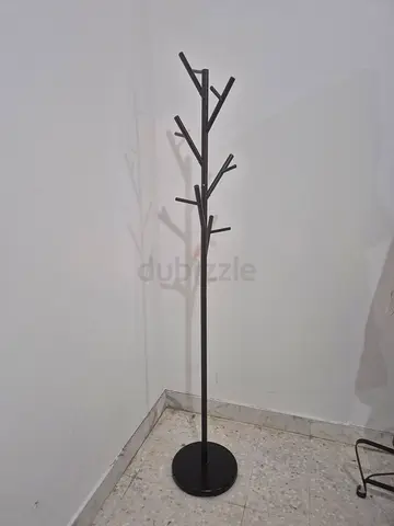 Minimalist black metal tree-style standing coat rack