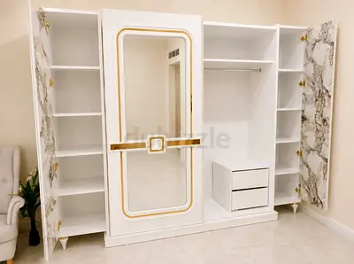 Modern White Wardrobe with Gold Detailing and Mirrored Door