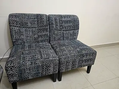 Pair of compact patterned accent chairs - good used condition