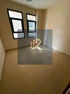 For annual rent: a top-rated three-bedroom apartment with a living room in the Al Taawun area of 