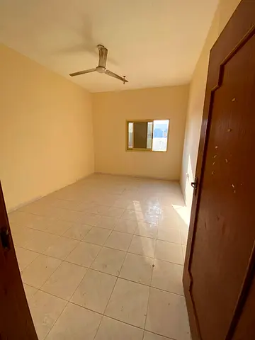 For rent in Al Bu Tina Sharjah one bedroom apartment with hall spacious layout central AC good finishing prime location near all services rent AED 240