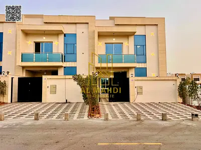 A villa in Al Helio 2, Ajman, consisting of 5 master bedrooms and a maid's room. AED 1,370,000 including registration and ownership fees, negotiable.