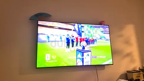 65-inch LED Samsung Smart TV mounted on wall - Good condition. Used only 1.5years