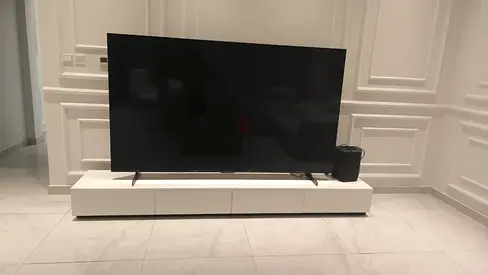 TCL 98inch LED TV in excellent working condition, includes large console table with drawers.