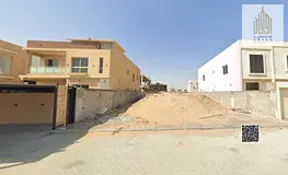 Residential land for villas for sale in Al Alia, 400 square meters, on a street and alley, priced at