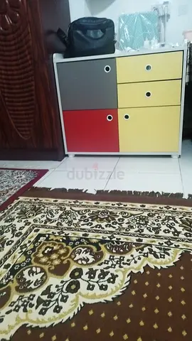 Compact multicolor bedside cabinet with drawers - good condition