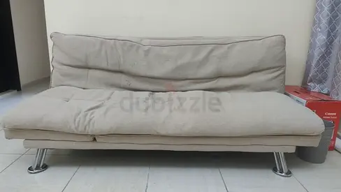 Beige fabric futon sofa bed with chrome legs good condition