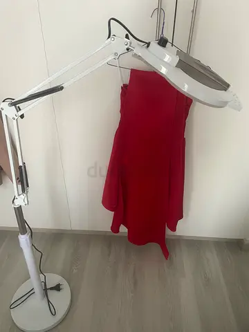 Cosmetic lamp with magnifying glass