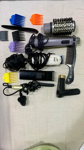 Hair styling set: hot air brush, trimmer, combs and attachments
