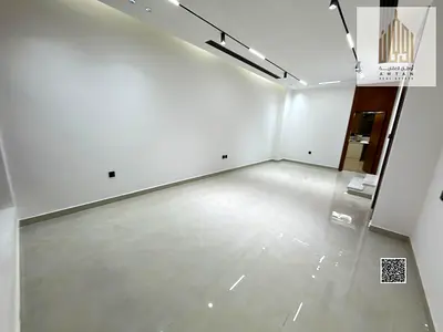 Luxury villa for sale in Al Yasmin, modern design with a spacious rooftop terrace, all fees included, at a special price.