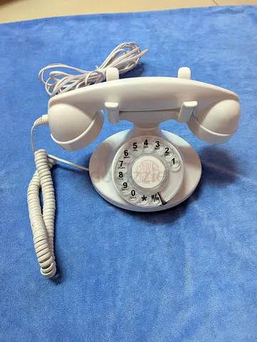 White Opis Technology FunkyFon cable rotary landline phone withWhite Opis Tech a retro 1920s design.