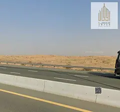 Commercial land for sale in Al Bataeh, Sharjah. Freehold ownership for all nationalities. Strategic
