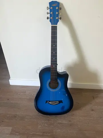 Blue acoustic guitar - good condition, playable - Price negotiable