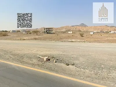 Residential land with street and alley access in Masfout 11 area,