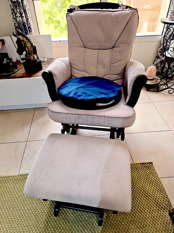 Beige nursing glider rocker with matching ottoman - gently used