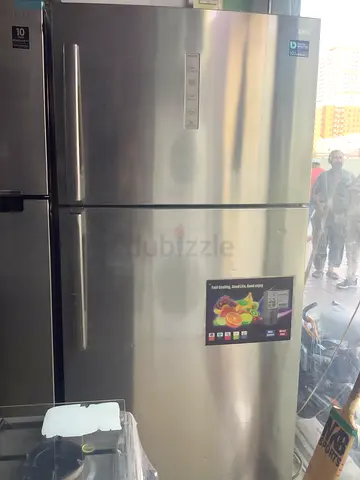 Large Stainless Steel Four-Door Refrigerator - Good Working Condition